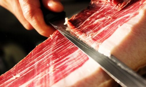 Cutting Spanish ham. Free food image, public domain CC0 photo. Cutting Spanish ham. Free food image, public domain CC0 photo.